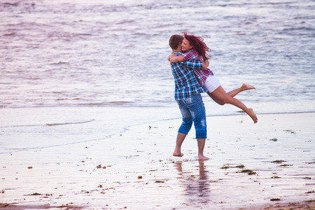 husband holding his wife, the couple just married on Hawaiiの写真素材