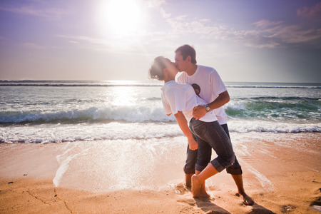wedding couple just kissing at blue beachの写真素材