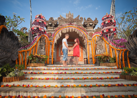Wedding ceremony of mature couple dressed in Bali, Indonesiaの写真素材