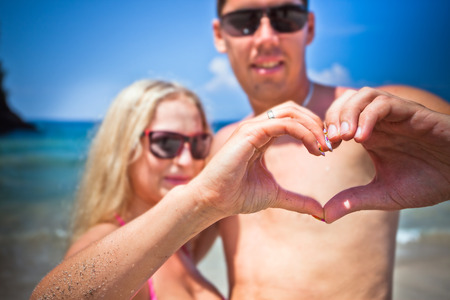 mature couple with love sign by handsの写真素材