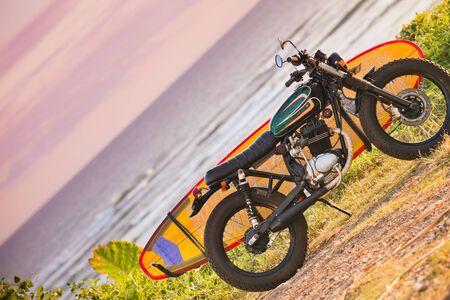 Motorcycle with surfboard at outdoors, Indonesian culture