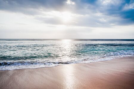 background of beach and ocean with blue skyの写真素材