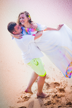 wedding couple dancing on the beachの写真素材