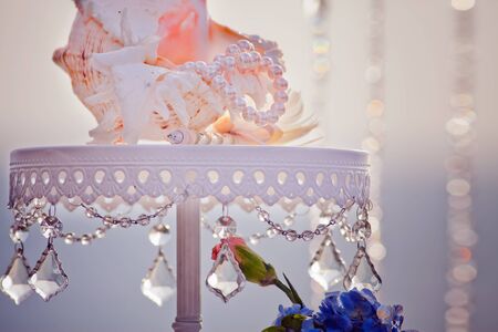 Wedding table with beautiful shell at blue sea backgroundの写真素材