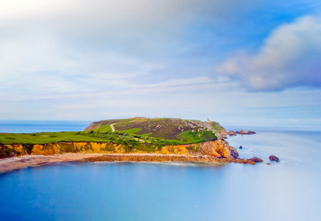 The End of Land. Finister in Bretagne, France. The beautiful seascape with rocks and island in the waterの写真素材