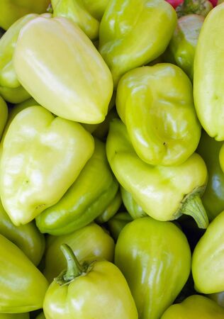 green sweet bell peppers natural on the background.の写真素材