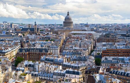 Horizontal panorama of the top view of one of the towers of Notre Dame in a usual summer day. In the background is seen Pantheon of Paris.の写真素材