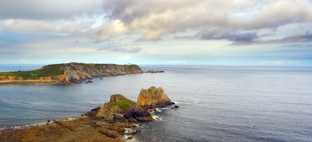 The End of Land. Finister in Bretagne, France. The beautiful seascape with rocks and island in the...
