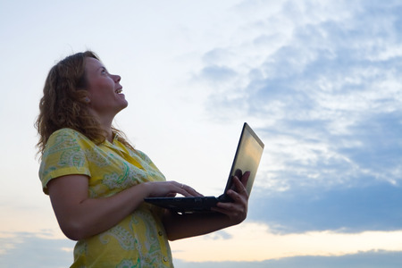 Young businessman working on laptop. Itâs his internet business, through wireless technologyの写真素材