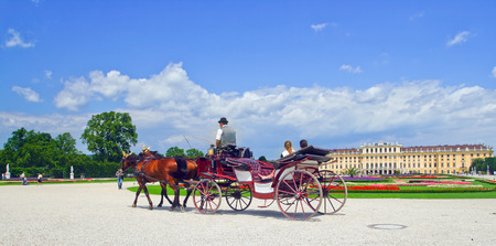 Image coach with tourists in the background of an ancient castle in Vienna, Austria.のeditorial素材