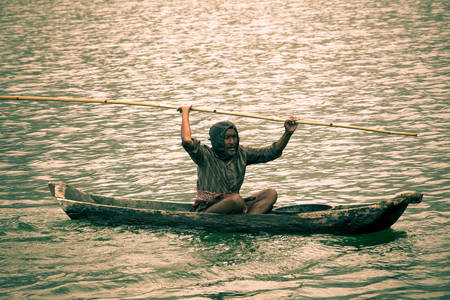 Indonesian fisherman fishing on a boat, Bali, Indonesiaのeditorial素材