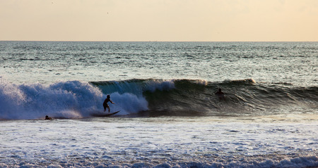 Surfer on Blue Ocean Wave in Bali, Indonesiaの写真素材