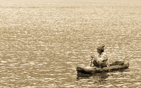 Indonesian fisherman fishing on a boat, Bali, Indonesiaのeditorial素材