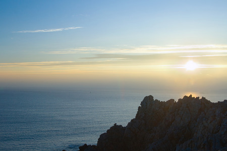 Picture beautiful sunset with the silhouette of cliffs in the cape Pen Hir. Bretagne.の写真素材