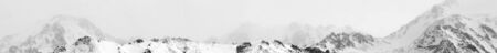 Black and white panorama image of snowy winter in rocky mountain. Amazing place for activity extreme sport in Almaty, Kazakhstan, Asiaの写真素材