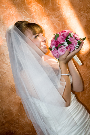 Portrait of beautiful happy bride, Just Married with Bouquet of Flowerの写真素材