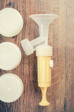 Manual breast pump, mothers breast milk is the most healthy food for newborn baby.の写真素材