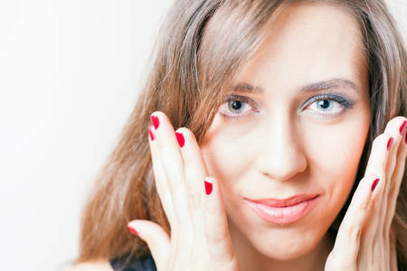 Glamour beautiful woman with perfect makeup and nails. Beauty concept image with white background...