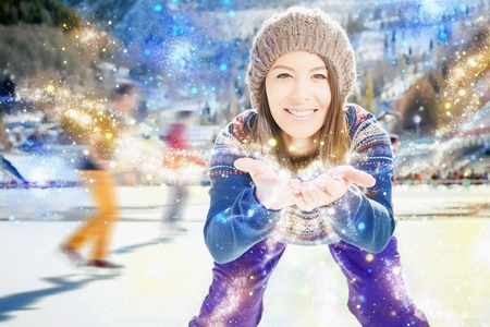 Girl asian appearance skates. Looking at the camera with arms extended forward. Smiles. From palms...