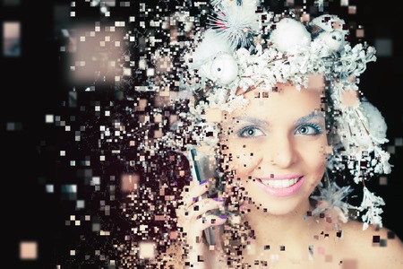 Winter Queen with white magical hairstyle using mobile phone. Christmas Makeup. Xmas woman. Photoshop, art effect of pixelated decomposition.の写真素材