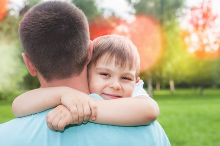 Father with his son walking outdoor. Child hugging dad. Family Love concept. Summer.の写真素材