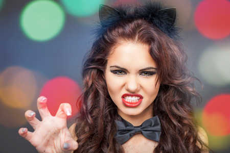 Sexy woman with cat carnival mask. Ears. Role-playing games. Games for Adults. Fashion. Venetian carnival. Sex shop. Hot babe. Party. Night backgroundの写真素材