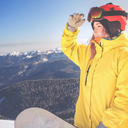 Snowboarder girl at Alps, Swiss mountain. Skier. Winter activities for good mood and healthy mind. Healthy lifestyle, sport and fun with your ski!の写真素材