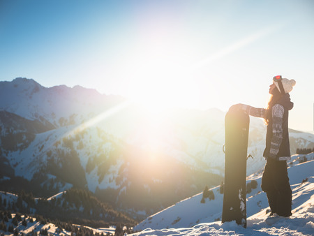 Adventure to winter sport. Snowboarder girlの写真素材