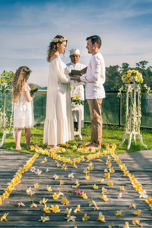 Happy newlyweds couple in marriage, wedding ceremony in Ubud.の写真素材