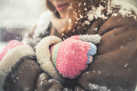 Closeup woman at cold snowy winter walking at New Yorkの写真素材