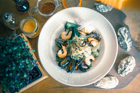Cooking seafood meal, raw seafood with mussels, clamsの写真素材