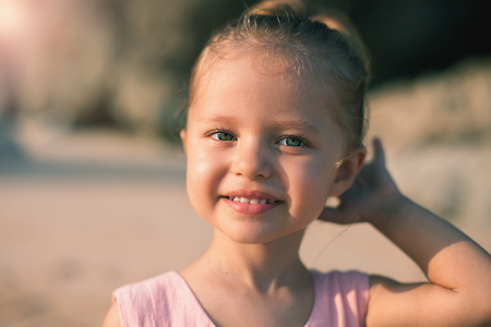 Concept, abstract image of beautiful little girl at the beach.の写真素材