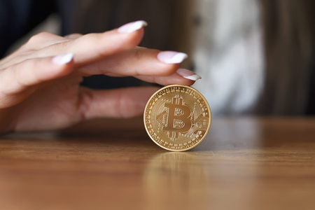 Successfully woman holds a Bitcoin. Crypto coin. Blockchainの写真素材