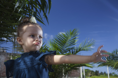 Funny Child looks like a wizard and she has some prediction.の写真素材