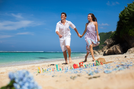 Portrait of Happy Couple, at the Beach, Holds Hands, Seaの写真素材