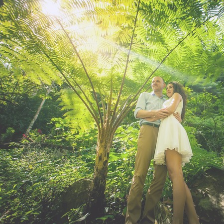 Happy couple walking at the rice terraces. Traveling at Bali.の写真素材