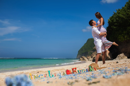 Happy Couple, at Beach, Holds Hands, Sea. Travel at Bali.の写真素材