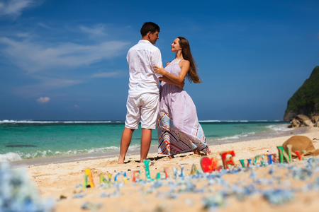 Happy Couple, at Beach, Holds Hands, Sea. Travel at Hawaii.の写真素材