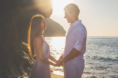 Portrait of happy couple, near the beach at background of sky.の写真素材
