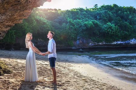 Portrait of happy couple, near the beach at background of sky.の写真素材