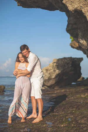 Portrait of happy couple, near the beach at background of sky.の写真素材