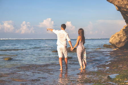 Portrait of Happy Couple at the Beach, Holds Handsの写真素材
