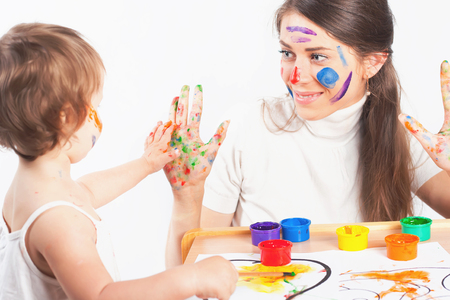 Mom and baby draws with colored inks paintの写真素材