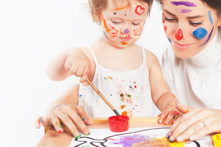 Mom and baby draws with colored inks paintの写真素材