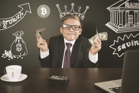 Concept of successful trader boy, trading bitcoin with stock exchangeの写真素材