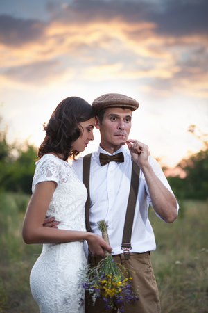 Young Couple Have Got Marriage In Rustic Style In Fieldの写真素材