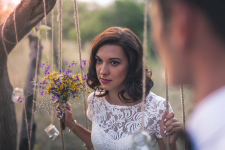 Young Couple Have Got Their Marriage In Rustic Style In Apple Orchardの写真素材
