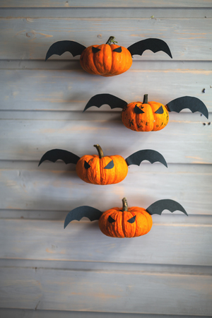 Pumpkin with wings carved for the holiday of halloweenの写真素材