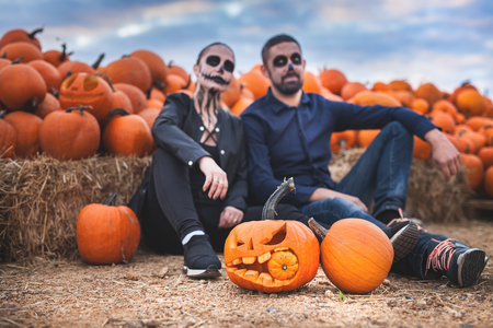Couple with scary makeup celebrating halloween outdoorの写真素材