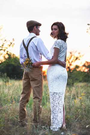 Young Couple Have Got Marriage In Rustic Style In Fieldの写真素材